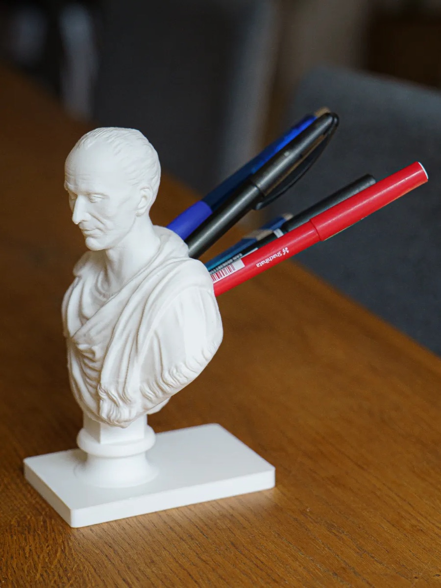 Julius Caesar bust pen holder with pens in its back